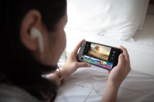 woman editing video on iphone